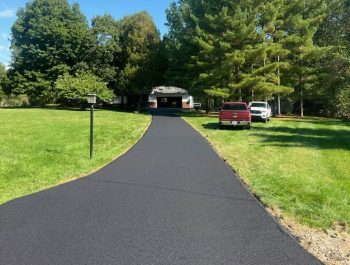 A neat blacktop driveway by Legacy Paving shows a well-done job, making the home look tidy and inviting with easy parking. A neat blacktop driveway by Legacy Paving shows a well-done job, making the home look tidy and inviting with easy parking.